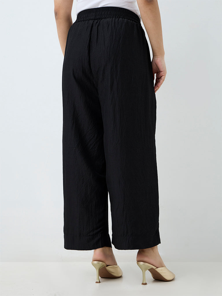 Diza Black Solid Cotton-Blend Pants