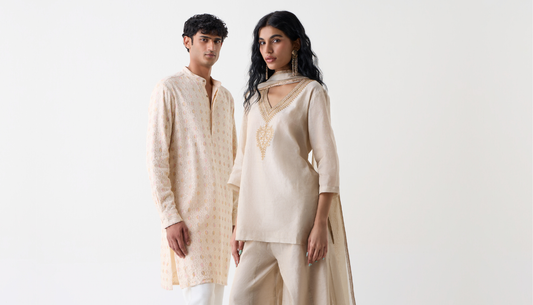 Women and men in Westside festive outfits for Diwali pooja, featuring elegant sarees, kurtas, and stylish accessories at Westside