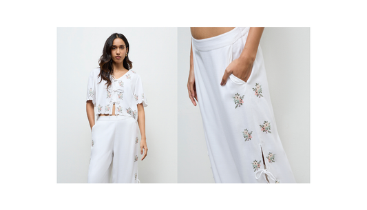 women styling tonal white outfits with ivory trousers cream blouse and neutral accessories