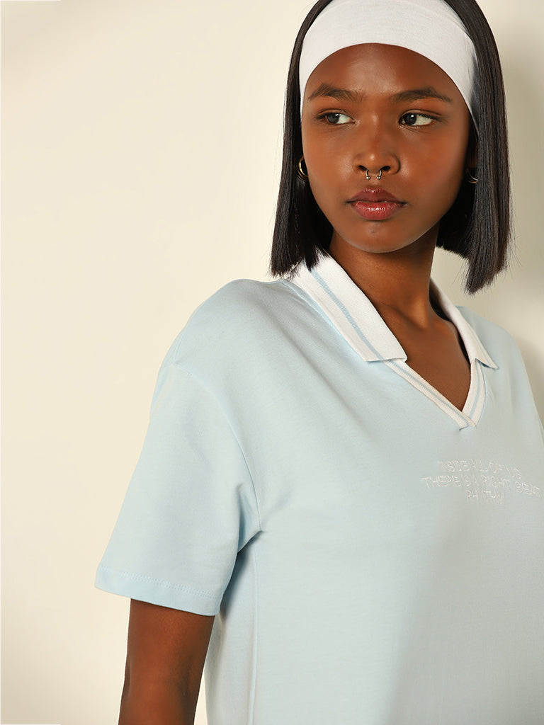 Westside Studiofit Women's Light Blue Text Design Collared Cotton T-Shirt for Sports Wear Zoomed View