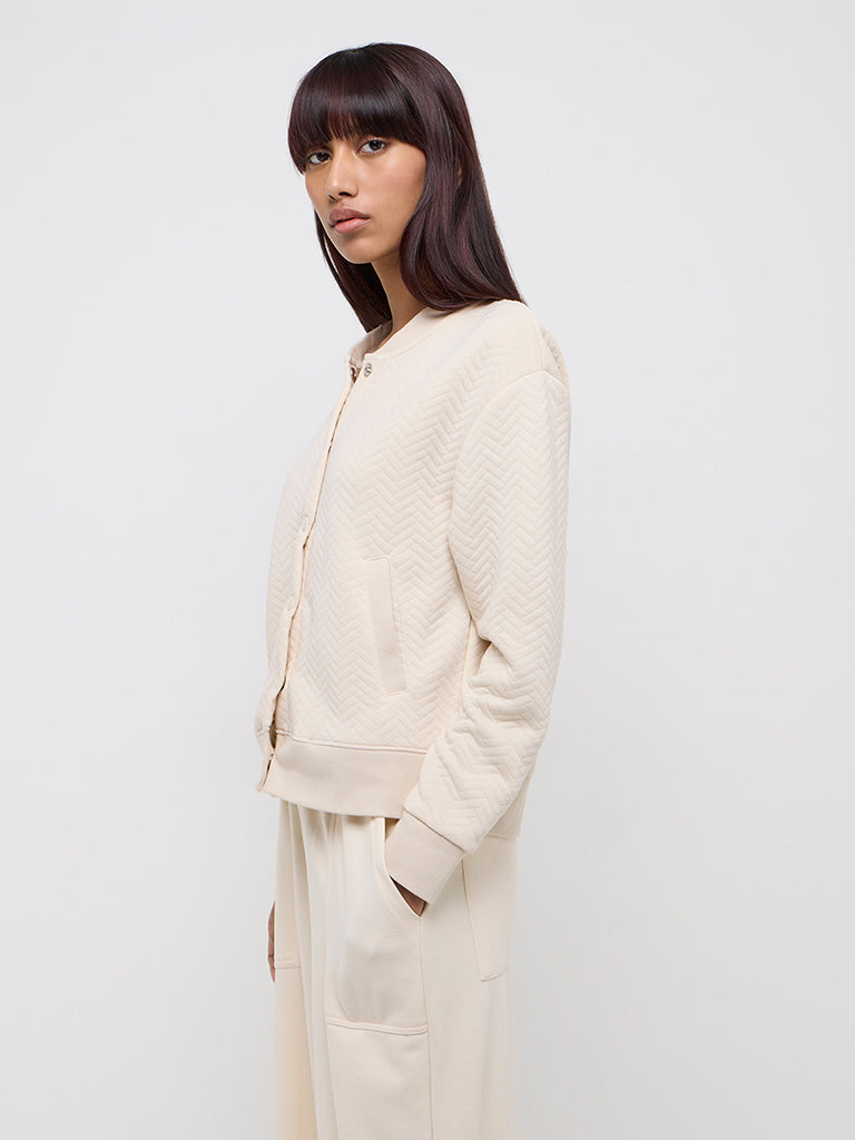 Westside Studiofit Women's Beige Chevron Textured Cotton-Blend Jacket for Sports Wear Front View