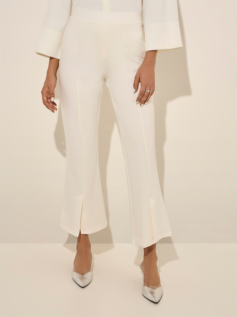 Westside Wardrobe Women's Off-White Slit-Detailed High-Rise Bootcut Trousers for Work Wear Front View