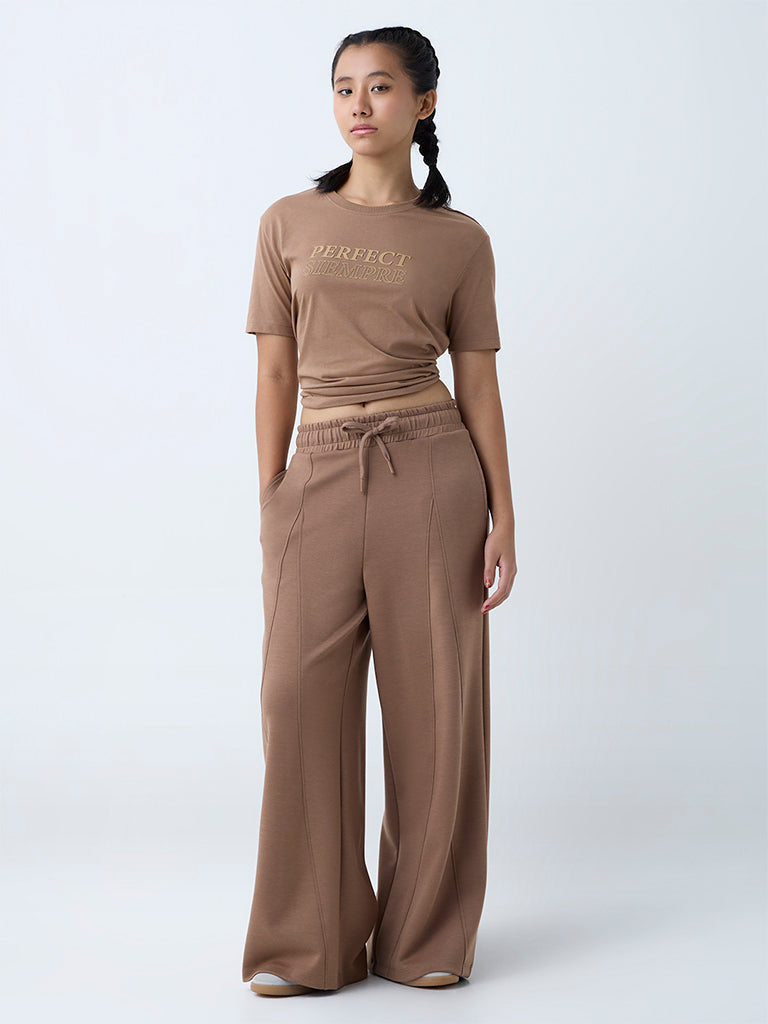 Westside Studiofit Women's Brown Solid High-Rise Track Pants for Sports Wear Full View