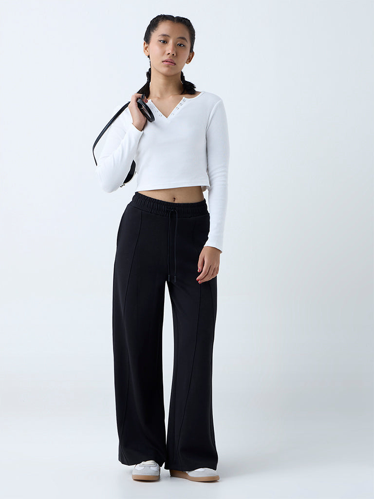 Westside Studiofit Women's Black Solid High-Rise Track Pants for Sports Wear Full View