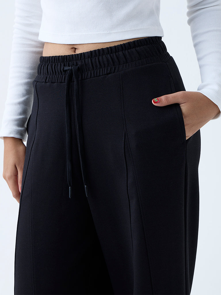 Westside Studiofit Women's Black Solid High-Rise Track Pants for Sports Wear Zoomed View