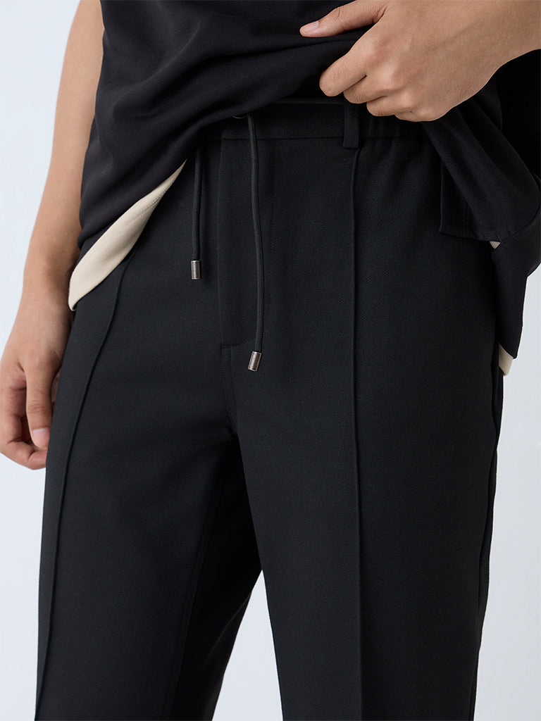 Westside Studiofit Men's Black Solid Relaxed-Fit Mid-Rise Pants for Sports Wear Zoomed View