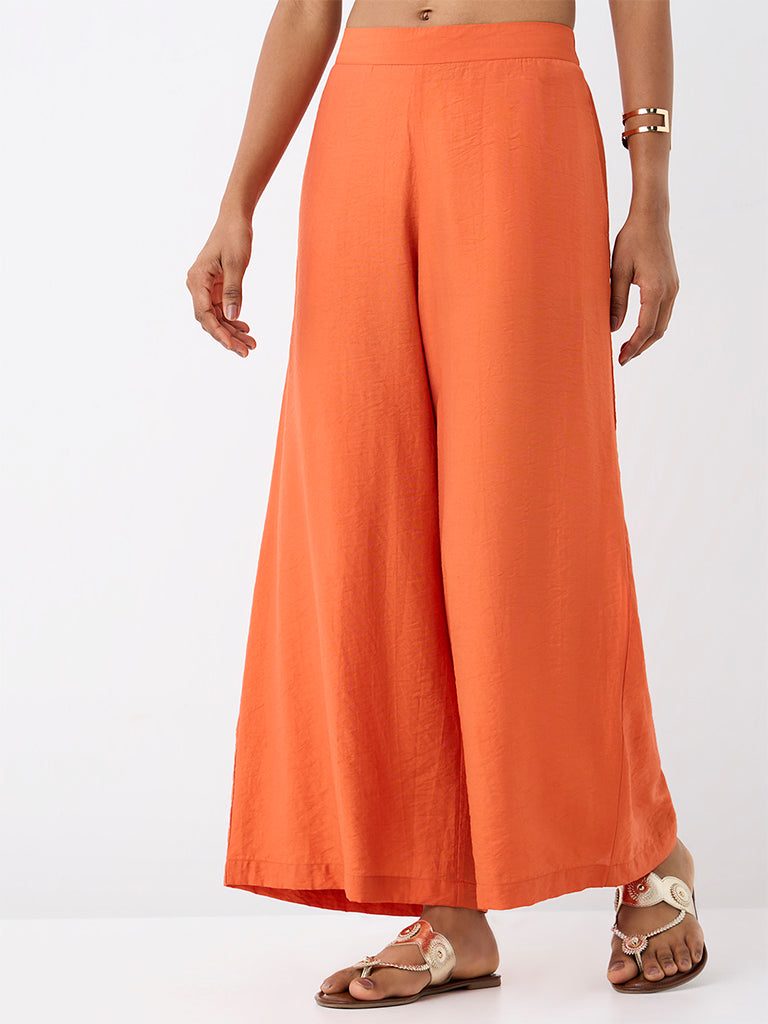 Utsa Orange Solid Cotton-Blend Palazzos