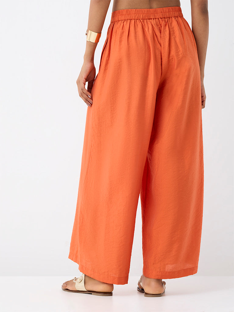 Utsa Orange Solid Cotton-Blend Palazzos