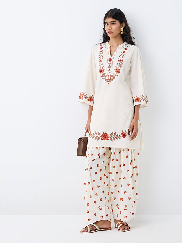 Utsa Off-White Floral Embroidered A-Line Kurta.